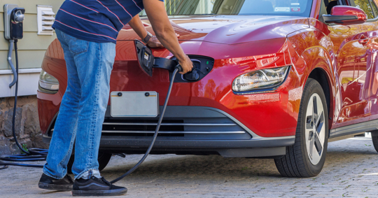 man charging his EV
