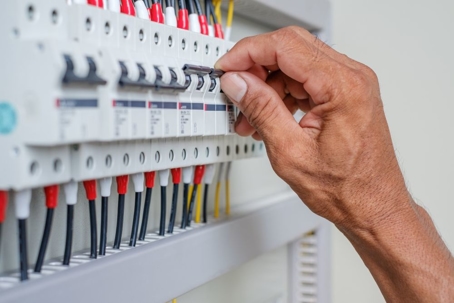 How do electrical service panels and breakers work?